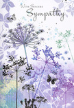 This sympathy card creates a sense of calm that recalls the quiet, tree-framed moments you might experience around Harrow Weald before the day fully begins. The design is a delicate study in line and watercolour: tall, fine stems stretch upward, each ending in a cluster of tiny, umbelliferous blossoms that look like fragile lace against the sky. The colours are kept to a soothing spectrum-lavender, dusky purple, indigo, and pale blue-softly blended with washes of muted green. These tones flow together in the background, forming a misty, abstract landscape that feels like the gentle blur of distant gardens or the soft outline of Harrow Weald Common on a dewy morning. The flowers appear light and airy, their edges dissolving into the background, giving the impression that they move subtly with an unseen breeze. Threaded through the stems, a couple of butterflies hover, depicted with just enough detail to show their wings but with a transparency that makes them seem almost spiritual. They serve as a comforting symbol of ongoing presence, even in the face of loss. Above this ethereal meadow, the words "With Sincere Sympathy" are written in a graceful script that echoes the curves of the stems. The typography is understated, aligning with the card's overall mood of quiet support rather than bold statement. The scene evokes the feeling of receiving a tender, thoughtfully composed condolence arrangement at home in Harrow Weald-something created with genuine care to offer solace. It is a gentle visual embrace, allowing space for tears, reflection, and the steadying comfort of nature's enduring beauty.